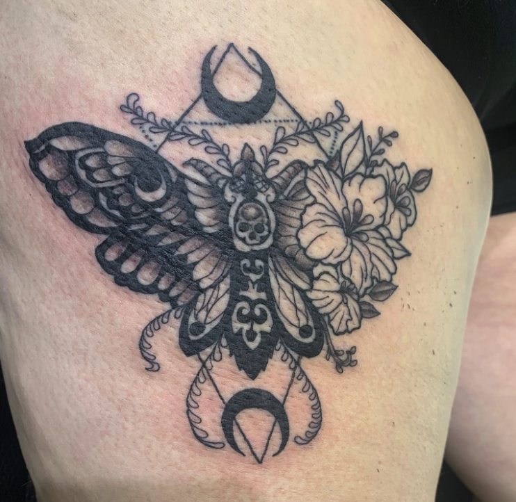 Butterfly flower and moon tattoo by Goose at Saginaw tattoo shop