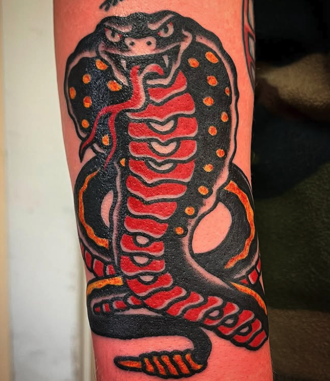 Cobra tattoo by Pat Schreader at Old Town Tattoo Saginaw